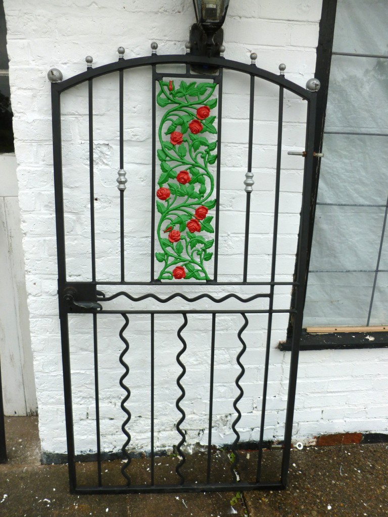 Ornate Wrought Iron Gates with inset Rose Design